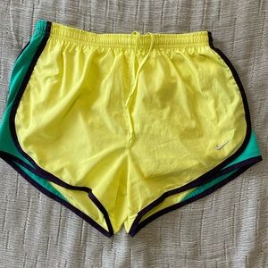 NIKE: yellow dri-fit shorts with navy & green accent